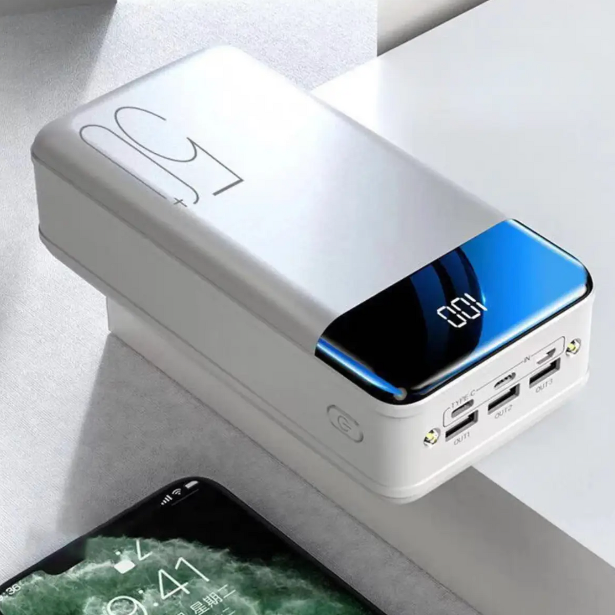 Portable TitanCharge 50,000mAh power bank being carried in a backpack demonstrating compact design