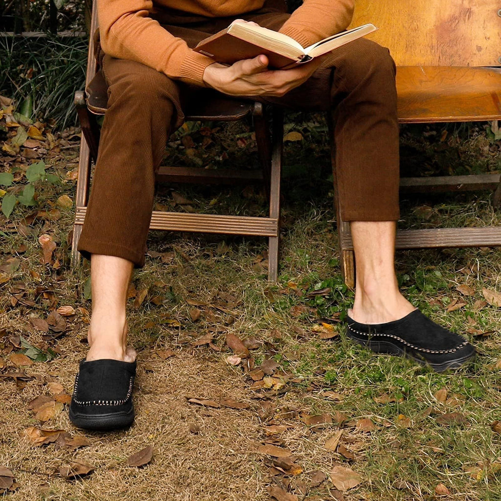 Side view of men's orthopedic slippers showing supportive structure and decorative stitching.