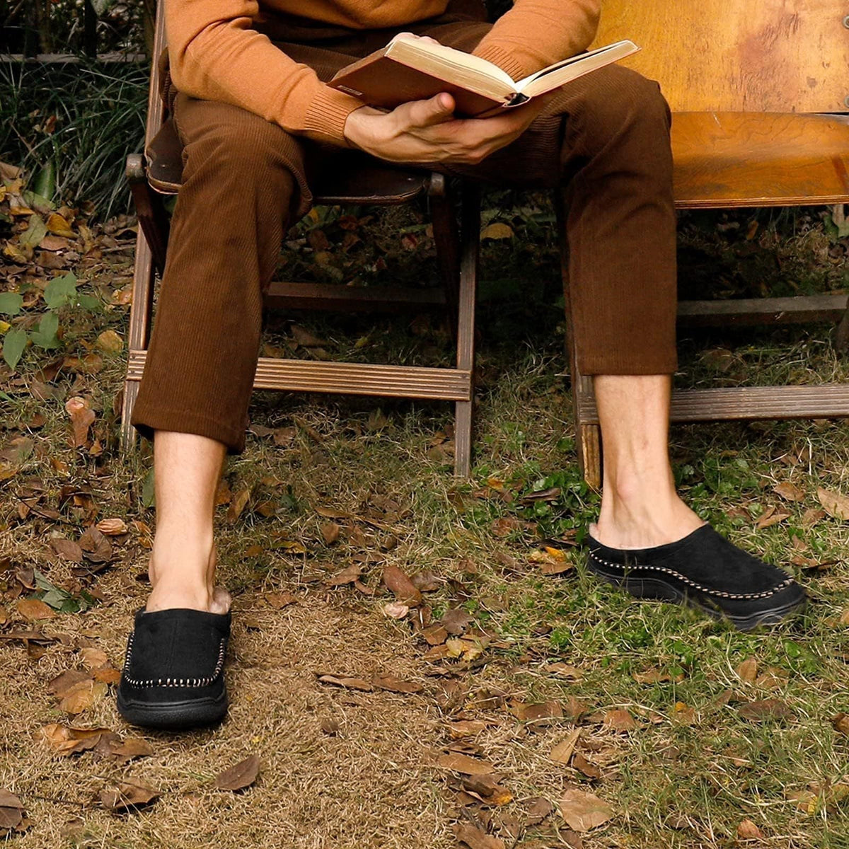 Side view of men's orthopedic slippers showing supportive structure and decorative stitching.