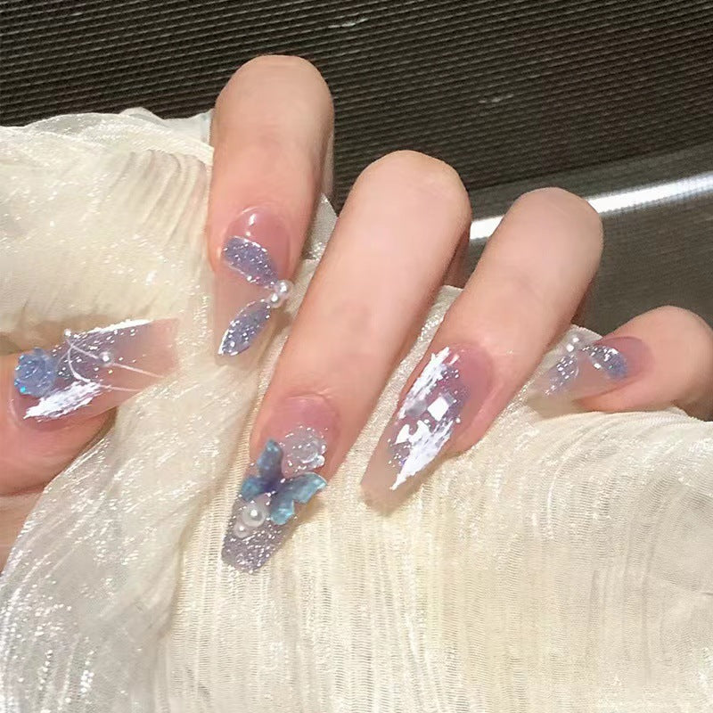 Artistic 3D nail extensions with glitter accents