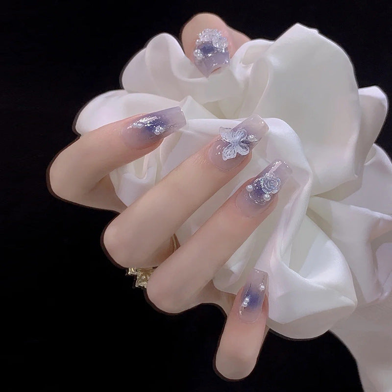 Artistic Acrylic Nails with Butterfly Design and Glitter Accents