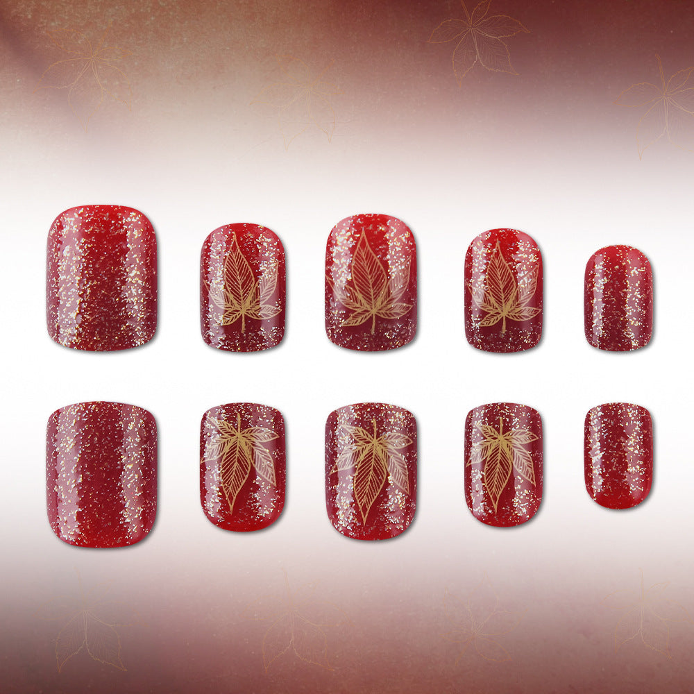 Artistic Leaf-Embellished Nail Art Design