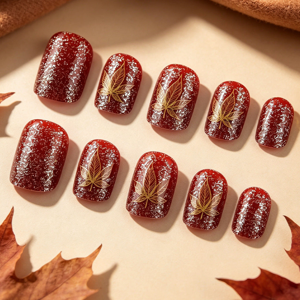 Artistic Leaf-Embellished Nail Art Design