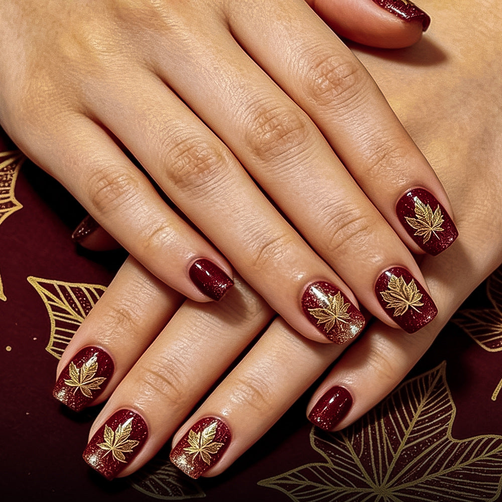 Artistic Leaf-Embellished Nail Art Design
