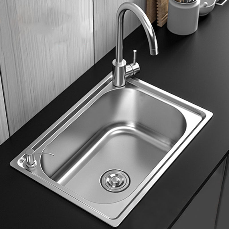 Modern workstation undermount kitchen sink in stainless steel with waste assembly and faucet