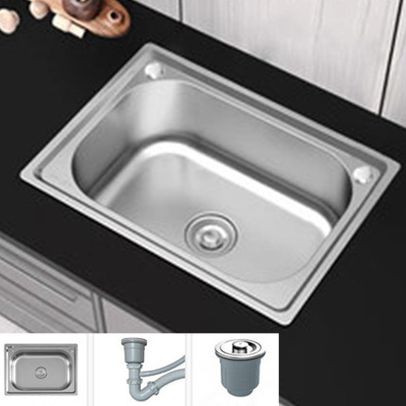 Modern workstation undermount kitchen sink in stainless steel with waste assembly and faucet