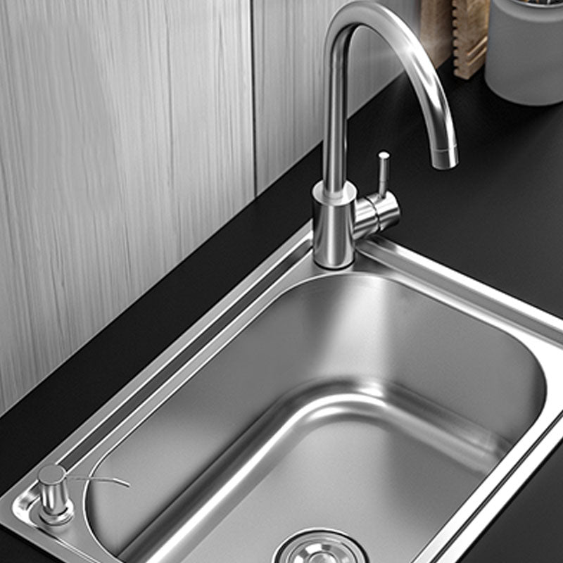Modern workstation undermount kitchen sink in stainless steel with waste assembly and faucet