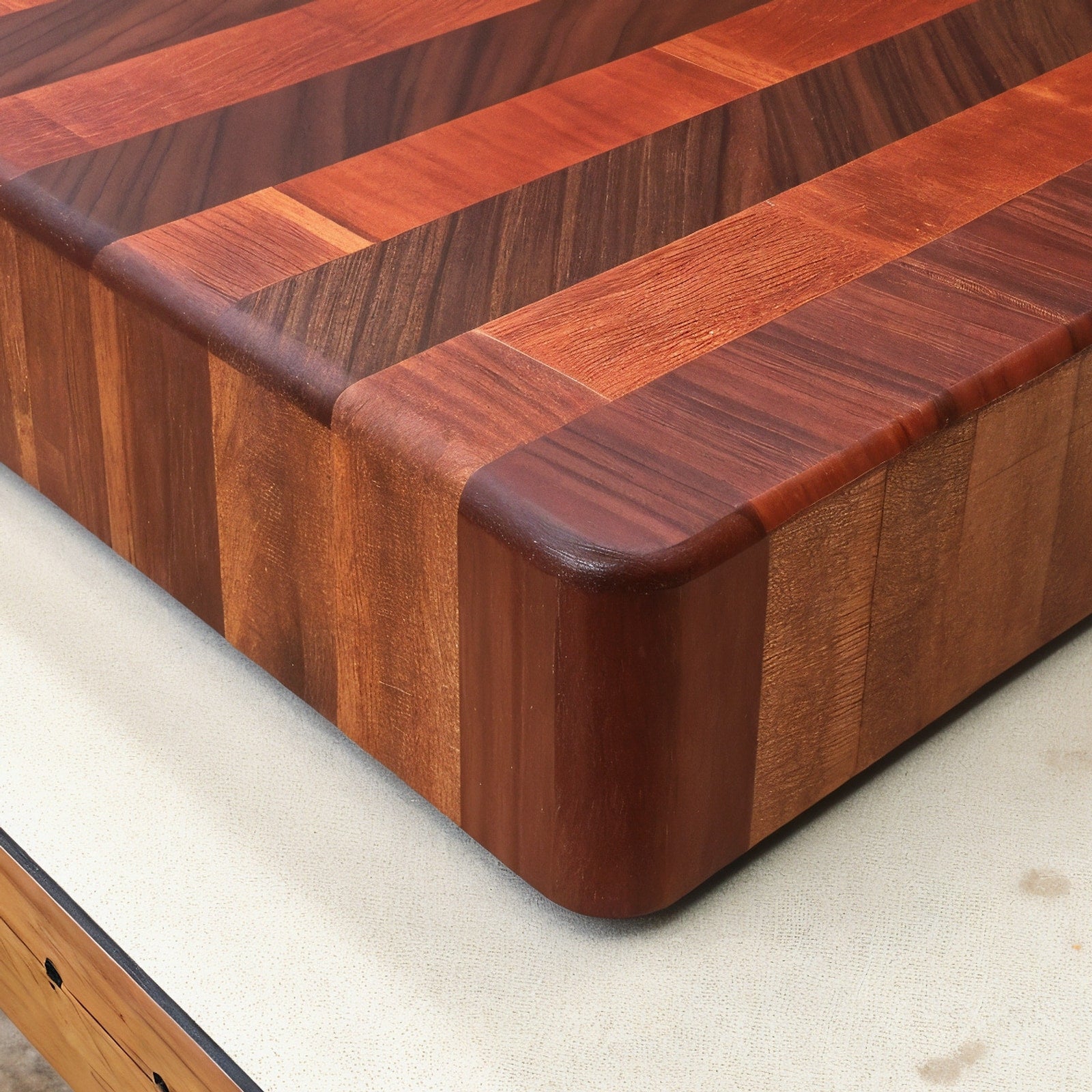Shopaverly Padauk Deluxe Butcher Block — close view of the front edge showing thickness and handle